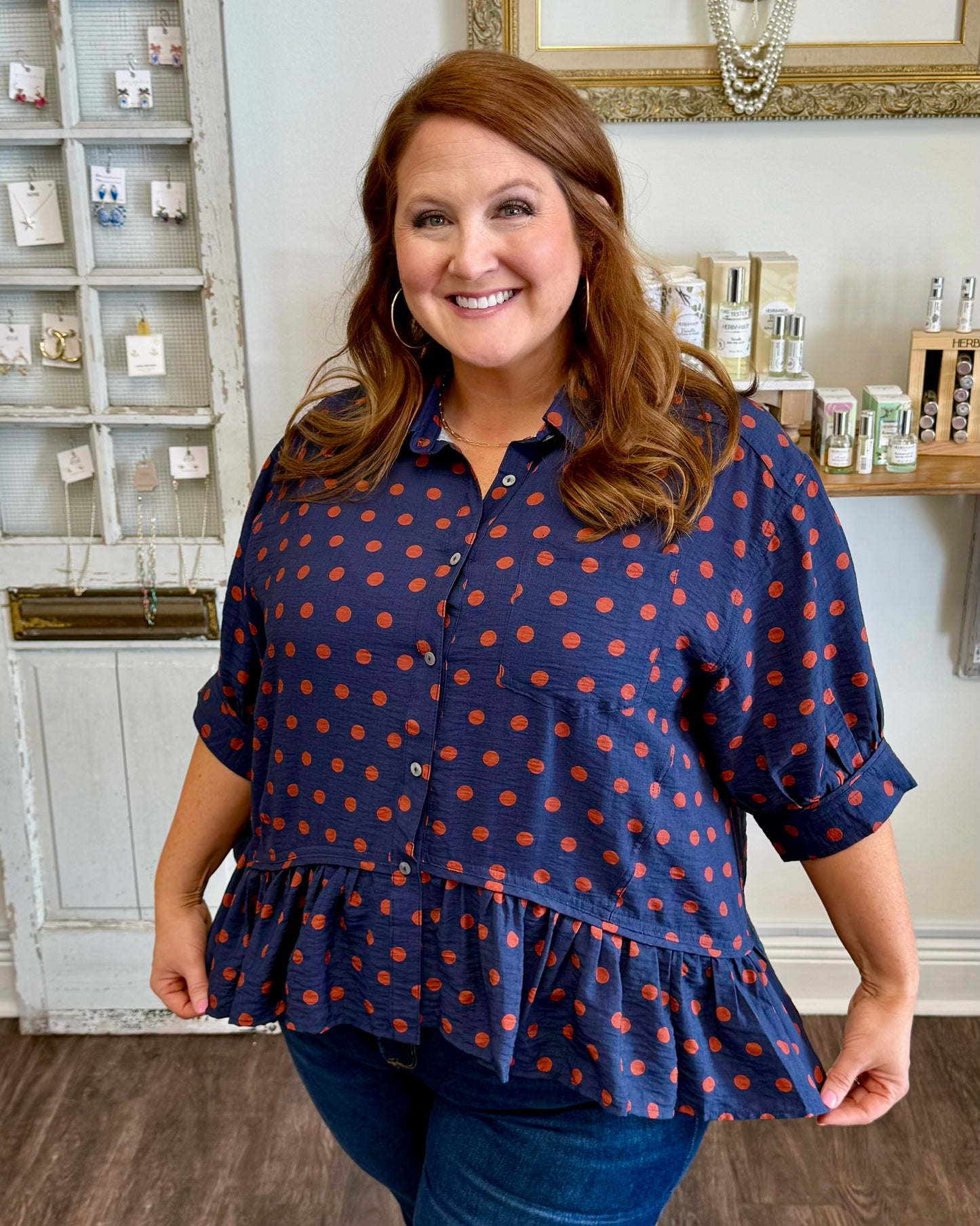 Navy Polka Dot Ruffle Hem Top