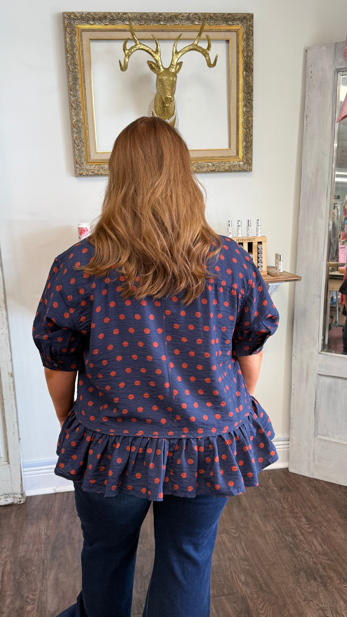 Navy Polka Dot Ruffle Hem Top