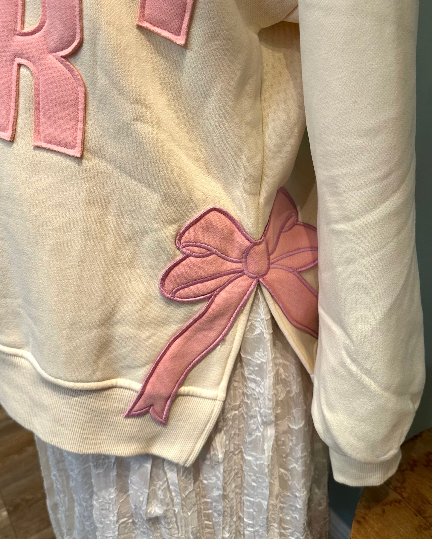 Ivory "MERRY" Sweatshirt with Bow Patch